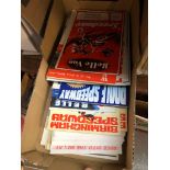 A box of Speedway programmes