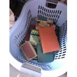 A laundry basket of books