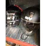 Two motor cycle crash helmets