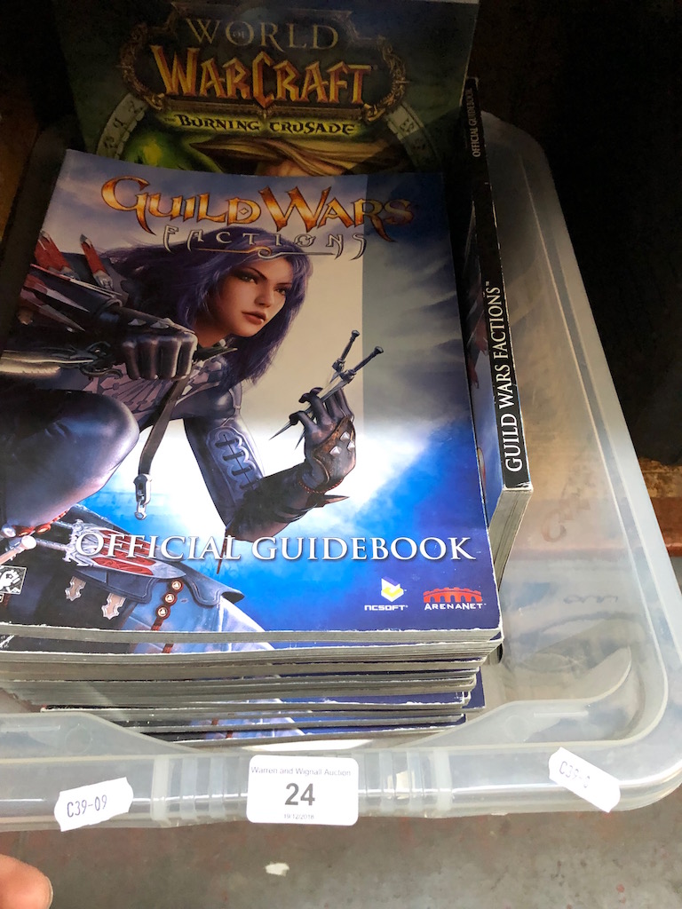 A box of Warcraft and Guild wars books