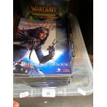 A box of Warcraft and Guild wars books