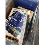 A box of motor racing programs