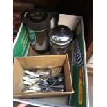 A box complete with cutlery, thermos flask and a cafetiere