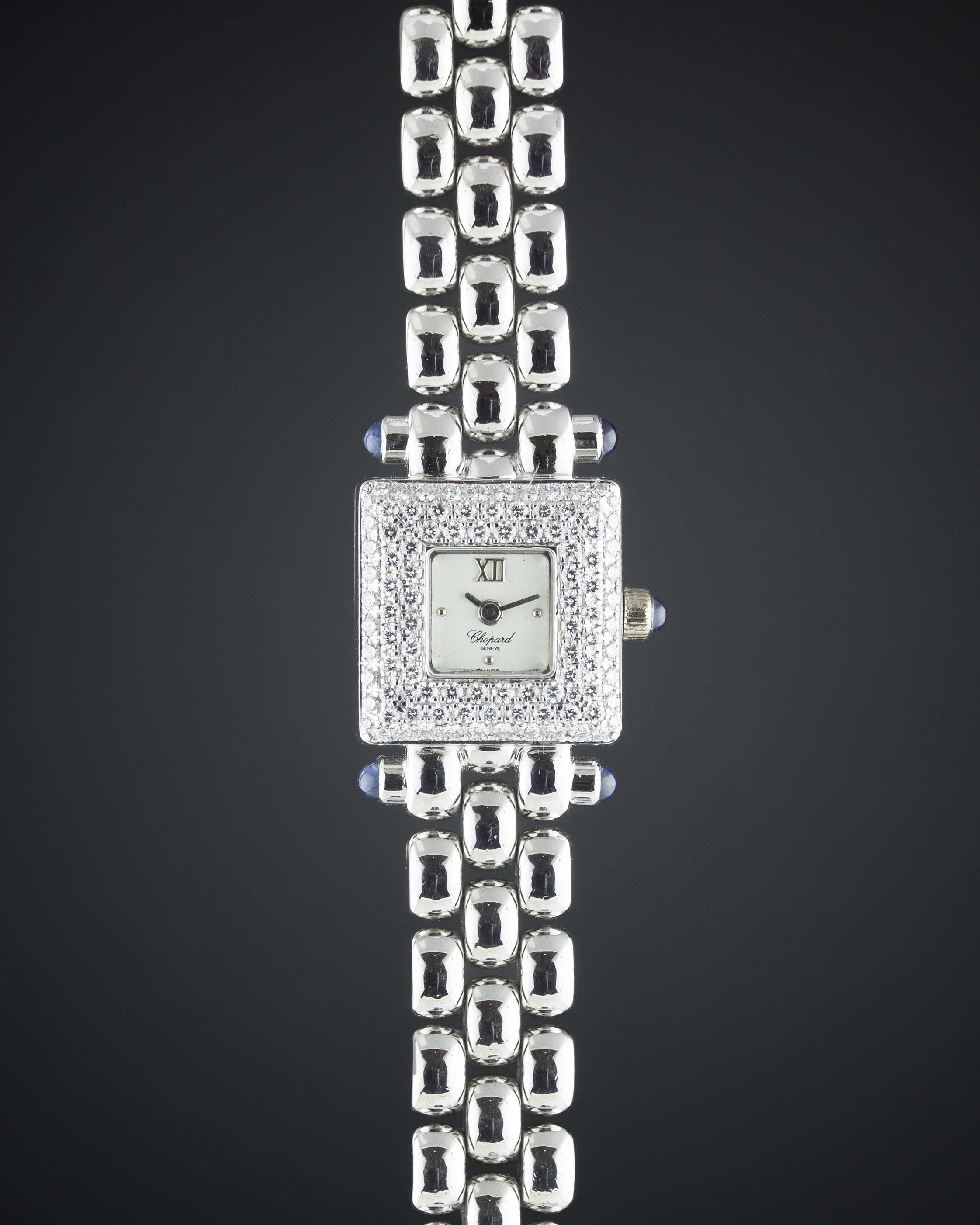 A LADIES 18K WHITE GOLD & DIAMOND CHOPARD BRACELET WATCH CIRCA 1990s Movement: Manual wind, signed