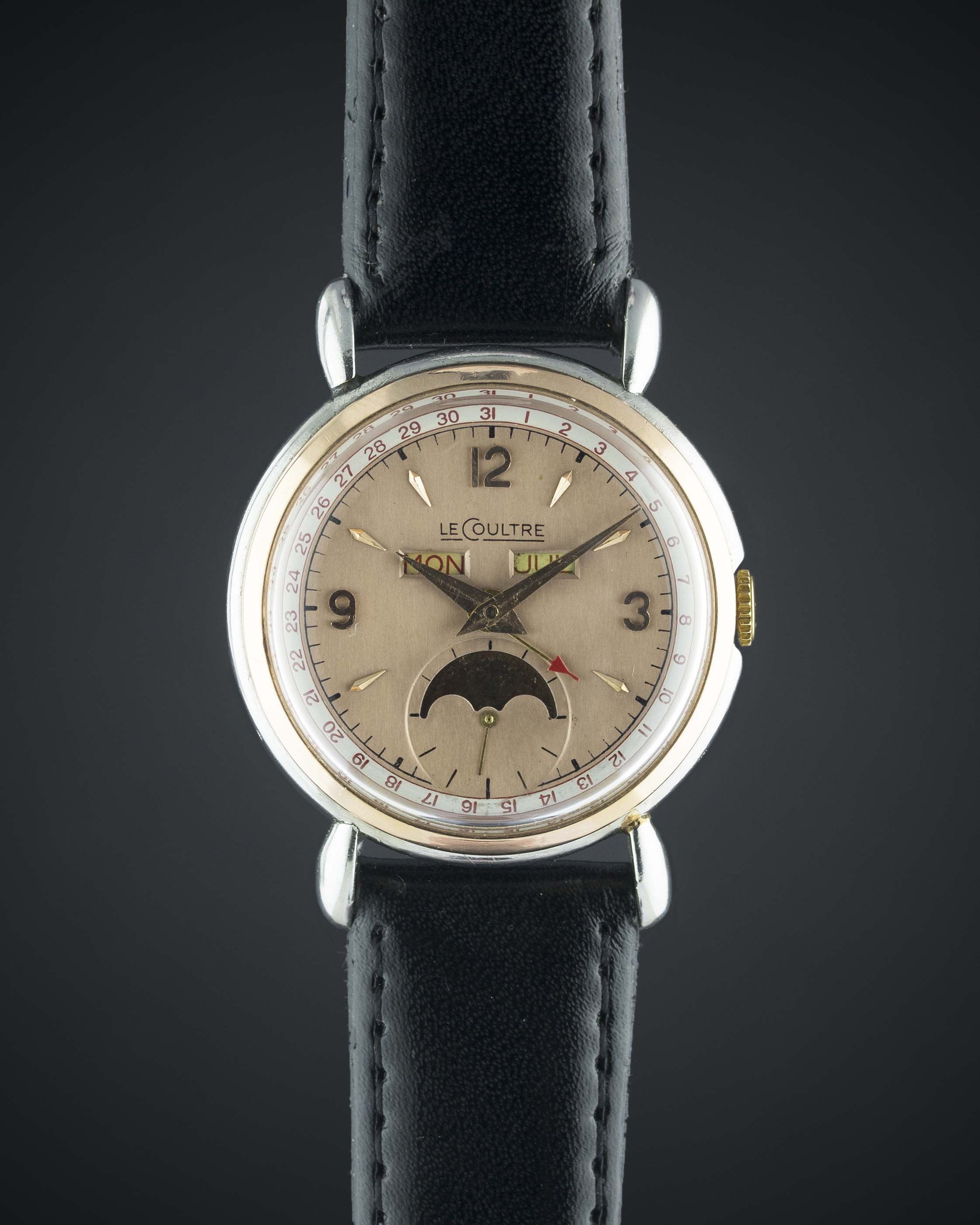 A GENTLEMAN'S STEEL & ROSE GOLD LECOULTRE MOONPHASE TRIPLE CALENDAR WRIST WATCH CIRCA 1950s