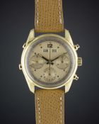 A FINE GENTLEMAN'S 18K SOLID GOLD "WATERPROOF" TRIPLE CALENDAR CHRONOGRAPH WRIST WATCH CIRCA 1950s