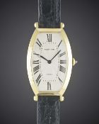A LARGE SIZE 18K SOLID GOLD CARTIER PARIS TONNEAU WRIST WATCH CIRCA 1990, FROM THE COLLECTION PRIVEE