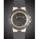 A GENTLEMAN'S SIZE 18K SOLID GOLD, TITANIUM & RUBBER BULGARI DIAGONO AUTOMATIC WRIST WATCH CIRCA