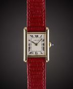 A LADIES 18K SOLID GOLD CARTIER TANK WRIST WATCH CIRCA 1980s Movement: Manual wind, signed