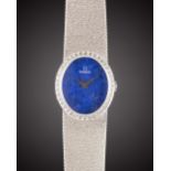 A LADIES 18K SOLID WHITE GOLD & DIAMOND OMEGA BRACELET WATCH CIRCA 1977, REF. 7-854 WITH LAPIS