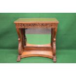 Carved mahogany console table the top having carved border over a pierced carved frieze,