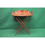 Late 20th century mahogany butlers tray and stand having pierced carrying handles and bow drop