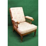 Regency beech framed library armchair having turned spindle back and padded arms with removable