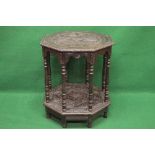 Victorian oak carved octagonal occasional table the top having a carved frieze and supported on