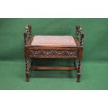 Oak carved barley twist piano stool having pierced side carrying handles,