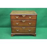 Georgian mahogany chest of three long drawers having shaped brass escutcheons and brass handles,