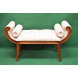 Late 20th century stained beech window seat having scrolled ends and bolsters,