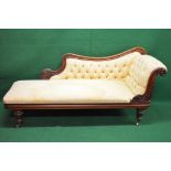 Mahogany chaise longue having buttoned upholstery and carved decorated surround,