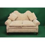 Double hump back two seater settee having two removable seat cushions and two scatter cushions,