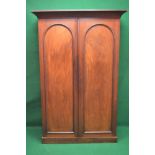 Victorian mahogany double wardrobe having two arched topped panelled doors opening to reveal