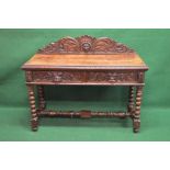 Victorian oak carved side table the top having carved border and raised carved back over two short