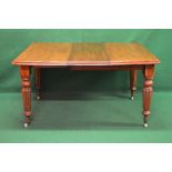 Victorian mahogany wind out dining table having one additional leaf,