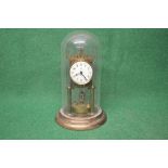 Brass Anniversary clock under glass dome having black numeral dial and black hands,