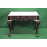 19th century Irish mahogany console table having white marble insert top over a carved frieze,