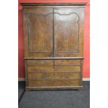 Dutch walnut linen cupboard having moulded cornice over two doors opening to reveal two fixed