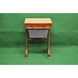 Victorian rosewood work table the top having rounded corners over single drawer with turned knob