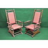 Two similar American style rocking chairs of turned spindle construction having padded head, back,