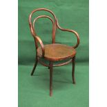 Thonet bentwood armchair having decorative plywood seat and bearing Thonet paper label to underside