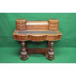 Victorian mahogany writing table having leather insert top with raised back of six small drawers