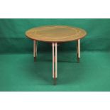 Mahogany circular dining table with geometric decoration on three shaped maple legs