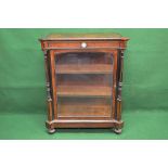 Walnut and ebonised pier cabinet having single glazed door opening to reveal two fixed shelves with