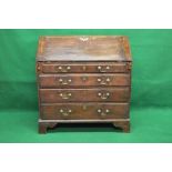 Georgian oak bureau having fall front opening to reveal fitted interior of pigeon holes,