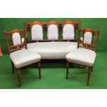 Mahogany inlaid framed settee having three section padded back supported on scrolled arms with