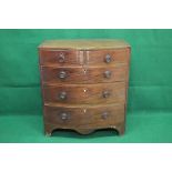 Mahogany bow fronted chest of two short and three long graduated drawers with brass hoop handles,