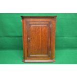 19th century oak wall hanging corner cupboard having dentil cornice over single fielded panel door