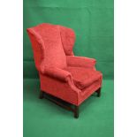 Late 20th century Georgian style wing back armchair having red upholstery,