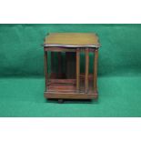 Mahogany revolving table top book stand having shaped top supported by square central column and