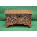 Miniature oak plank coffer the top lifting to reveal storage space and the front having carved