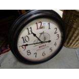 Large reproduction wall clock with Bicycle advertising dial