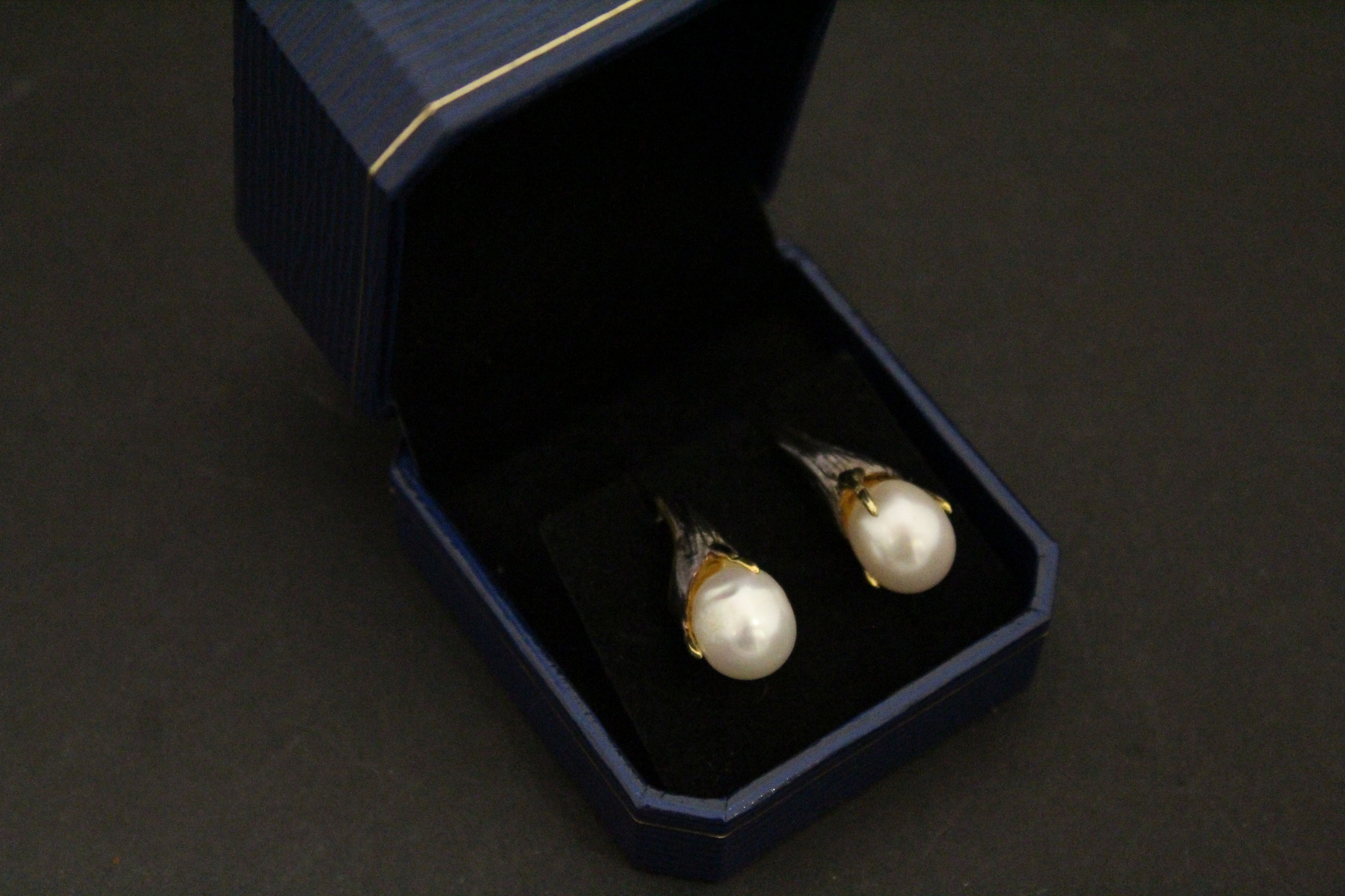 Pair of silver and baroque pearl earrings