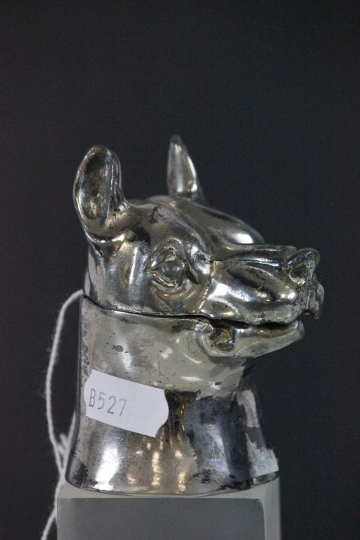 A vintage inkwell in the form of a dogs head