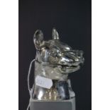 A vintage inkwell in the form of a dogs head