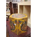A six sided oriental wooden box with painted dragon decoration.