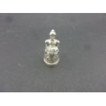 An unusual Silver thimble and needle sand needle case in the form of a young lady