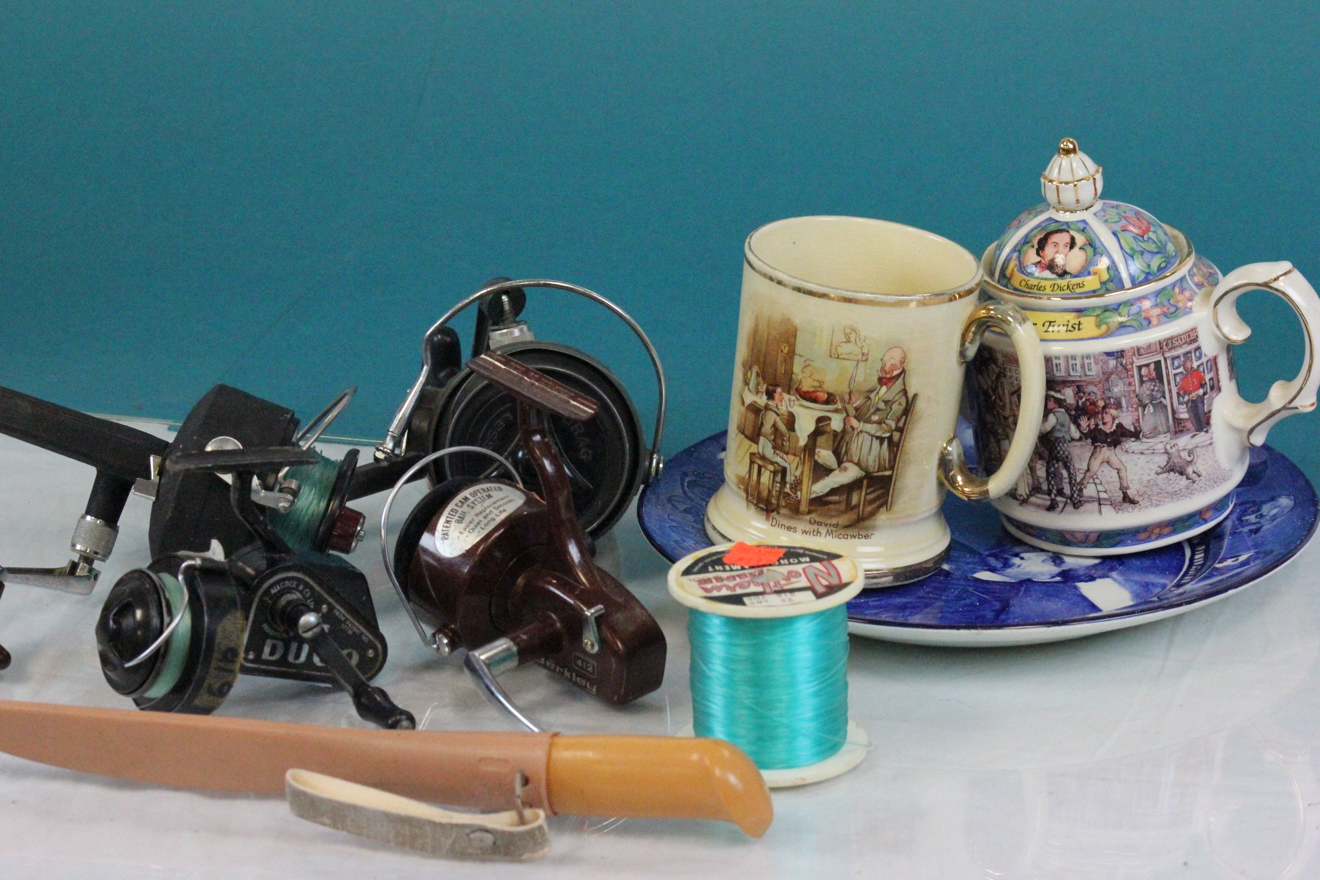 Four vintage Fishing reels and a fishing knife with sheath plus a small selection of ceramics and