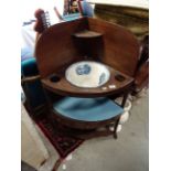 A Georgian mahogany three tier washstand with drawers.